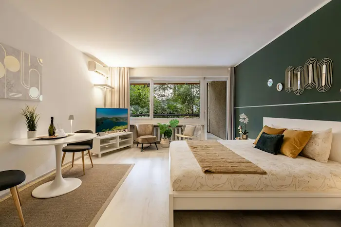 Studio moderne avec lit et coin repas, image illustrant l’achat d’une SCI